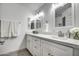 Modern bathroom with double vanity and white cabinets at 3135 N 34Th St, Phoenix, AZ 85018