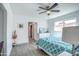 Bright bedroom with a teal comforter and gray wood-look floors at 3135 N 34Th St, Phoenix, AZ 85018