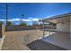 Spacious backyard featuring gravel, a covered patio, and mature plants at 3135 N 34Th St, Phoenix, AZ 85018