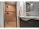 Updated bathroom with a walk-in shower and dark vanity at 3135 N 34Th St, Phoenix, AZ 85018