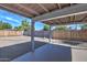 Covered patio and gravel backyard with wood fence at 3135 N 34Th St, Phoenix, AZ 85018