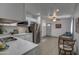 Modern kitchen with white cabinets and stainless steel appliances at 3135 N 34Th St, Phoenix, AZ 85018