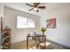 Home office with a rustic desk and ceiling fan at 3135 N 34Th St, Phoenix, AZ 85018