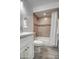 Updated bathroom with beige tile and white vanity at 3135 N 34Th St, Phoenix, AZ 85018