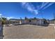 Large backyard with covered patio and gravel landscaping at 3135 N 34Th St, Phoenix, AZ 85018