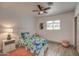 Light and airy bedroom with a twin-size bed and ceiling fan at 3135 N 34Th St, Phoenix, AZ 85018