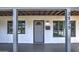 Front entrance with covered porch and gray door at 3135 N 34Th St, Phoenix, AZ 85018