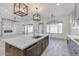 Spacious kitchen with large island, quartz countertops, and modern lighting at 15528 E Chicory Dr, Fountain Hills, AZ 85268