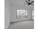 Bright bedroom with sliding window and carpet flooring at 15528 E Chicory Dr, Fountain Hills, AZ 85268