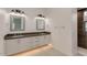Modern bathroom with double vanity, dark countertops, and gray tile at 15528 E Chicory Dr, Fountain Hills, AZ 85268