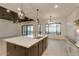 Open kitchen with island, modern lighting, and access to backyard at 15528 E Chicory Dr, Fountain Hills, AZ 85268