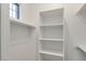 Spacious closet with shelves and hanging rods for ample storage at 15528 E Chicory Dr, Fountain Hills, AZ 85268