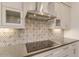 Modern kitchen features a stylish backsplash and high-end range hood at 15528 E Chicory Dr, Fountain Hills, AZ 85268