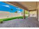 Covered patio overlooking a beautifully landscaped backyard with artificial turf at 15528 E Chicory Dr, Fountain Hills, AZ 85268