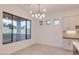 Bright dining area with large window and modern chandelier at 15528 E Chicory Dr, Fountain Hills, AZ 85268