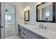Modern bathroom with double vanity, quartz countertops, and gray cabinets at 15528 E Chicory Dr, Fountain Hills, AZ 85268