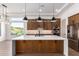Modern kitchen with large island, stainless steel appliances, and wood cabinets at 15522 E Chicory Dr, Fountain Hills, AZ 85268