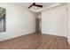 Spacious bedroom with wood-look tile flooring and ceiling fan at 15522 E Chicory Dr, Fountain Hills, AZ 85268