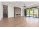 Living room with modern fireplace, sliding doors, and hardwood floors at 15522 E Chicory Dr, Fountain Hills, AZ 85268