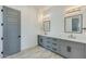 Modern bathroom with double vanity, gray cabinets, and quartz countertop at 15522 E Chicory Dr, Fountain Hills, AZ 85268