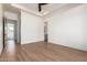 Bright bedroom with wood-look floors and access to hallway at 15522 E Chicory Dr, Fountain Hills, AZ 85268