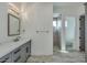 Elegant bathroom with gray cabinets, quartz countertop and a walk-in shower at 15522 E Chicory Dr, Fountain Hills, AZ 85268