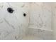 Walk-in shower with marble-look tile and built-in seat at 15522 E Chicory Dr, Fountain Hills, AZ 85268