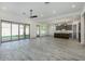 Open concept living room and kitchen with sliding doors to backyard at 15522 E Chicory Dr, Fountain Hills, AZ 85268