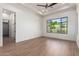 Spacious bedroom with wood-look tile flooring and large window at 15522 E Chicory Dr, Fountain Hills, AZ 85268