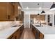Modern kitchen with large island, stainless steel appliances, and wood cabinets at 15522 E Chicory Dr, Fountain Hills, AZ 85268
