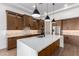 Modern kitchen with large island, stainless steel appliances, and wood cabinets at 15522 E Chicory Dr, Fountain Hills, AZ 85268
