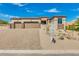 Stunning home with a three-car garage and rock landscaping at 15522 E Chicory Dr, Fountain Hills, AZ 85268