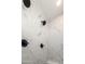 Walk-in shower with marble-look tile and multiple shower heads at 15522 E Chicory Dr, Fountain Hills, AZ 85268