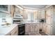 L-shaped kitchen with updated appliances and cabinets at 915 Mineshaft Dr, Apache Junction, AZ 85119