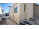 Side view of the house showcasing its exterior features and AC unit at 915 Mineshaft Dr, Apache Junction, AZ 85119