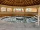 Relax in this community hot tub under a covered patio at 915 Mineshaft Dr, Apache Junction, AZ 85119