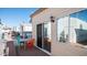 Small patio with table and chairs, adjacent to the house and a storage shed at 915 Mineshaft Dr, Apache Junction, AZ 85119