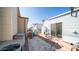 Backyard with a bike, patio furniture, and adjacent buildings at 915 Mineshaft Dr, Apache Junction, AZ 85119