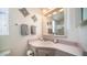 Bathroom features a vanity, mirror, and decorative wall art at 915 Mineshaft Dr, Apache Junction, AZ 85119