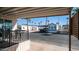 Covered patio with table and chairs, overlooking community at 915 Mineshaft Dr, Apache Junction, AZ 85119