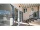 Covered patio with sliding glass door and steps at 915 Mineshaft Dr, Apache Junction, AZ 85119