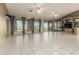 Spacious living room with tiled floors and golf course view at 402 W Beechnut Pl, Sun Lakes, AZ 85248