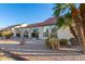 Landscaped backyard with stonework and golf course view at 402 W Beechnut Pl, Sun Lakes, AZ 85248
