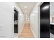 Bright hallway with light wood floors and shiplap walls at 8014 E Del Tesoro Dr, Scottsdale, AZ 85258
