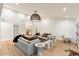Light-filled living room with a sectional sofa and stylish decor at 8014 E Del Tesoro Dr, Scottsdale, AZ 85258