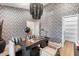 Home office featuring patterned wallpaper and built-in shelving at 8014 E Del Tesoro Dr, Scottsdale, AZ 85258