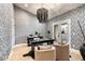 Stylish home office with a statement chandelier and built-in shelving at 8014 E Del Tesoro Dr, Scottsdale, AZ 85258