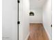 Bright hallway with hardwood floors and a window at 8014 E Del Tesoro Dr, Scottsdale, AZ 85258
