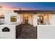 Bright and airy home exterior with a covered entryway and beautifully landscaped front at 8014 E Del Tesoro Dr, Scottsdale, AZ 85258