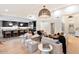 Open-concept living room with a view of the modern kitchen and breakfast nook at 8014 E Del Tesoro Dr, Scottsdale, AZ 85258